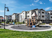 Thumbnail 5 of 16 - Children's Playground with Slide at Three Bedroom Apartments in Colorado Springs 80921