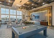 Thumbnail 6 of 16 - Upscale Resident Clubhouse with Pool Table at CO Springs Apartments Near Powers Blvd