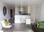 Thumbnail 3 of 5 - a kitchen and living room with a white