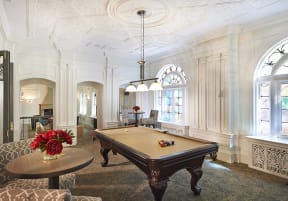a billiards room with a pool table in the center of it at Residences at Forest Park, Saint Louis, Missouri