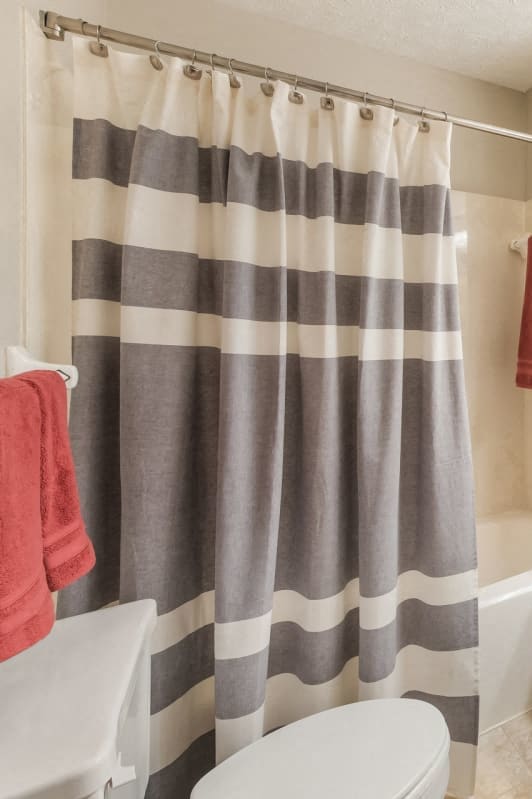 a bathroom with a shower and a sink and a toilet at Parkside at Maple Canyon Apartments, Columbus, OH 43229