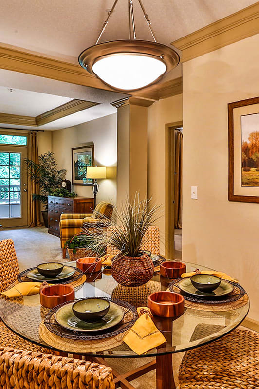 a dining room with a table and chairs