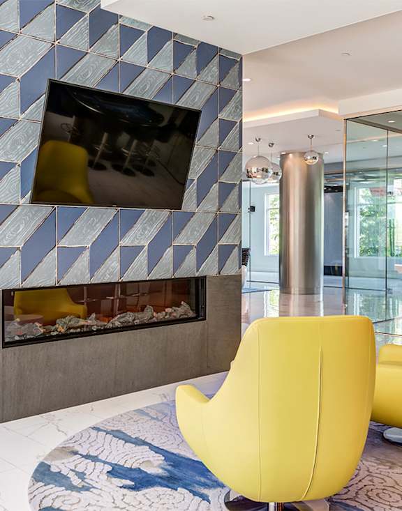 a living room with a fireplace and a tv on the wall at Ascend Apollo Apartments, Largo, Maryland