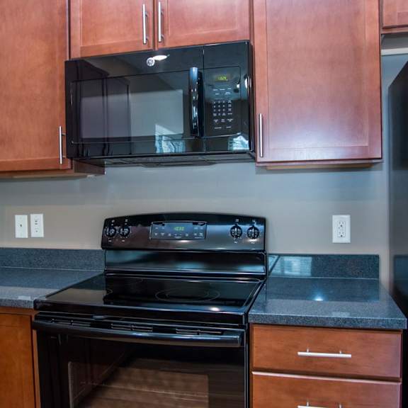 Black oven with a black microwave above it