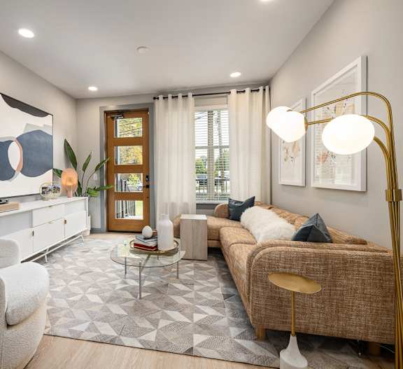 a living room with a couch and two chairs