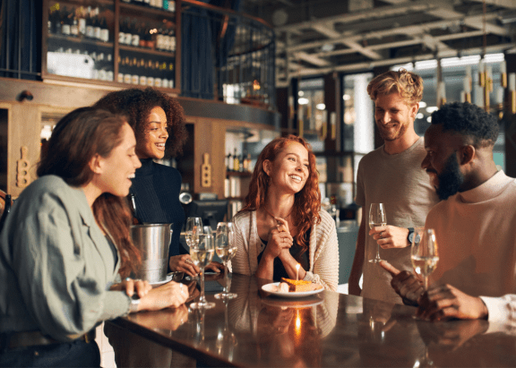 group of people at a bar talking and drinking wine at Connect on Northern Apartments, Glendale, AZ, 85301