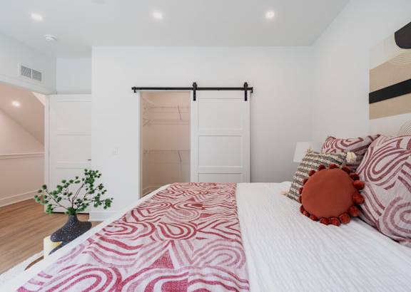 a bedroom with a bed and a closet at Matilda 235 Townhomes, Des Moines, 50309