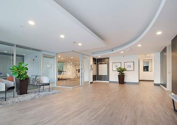 A spacious office with wood floors and a curved ceiling.at Plaza Lafayette, Los Angeles California