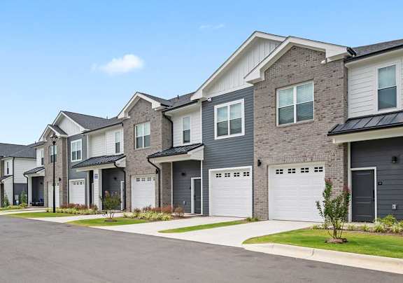 A row of modern houses with garages.