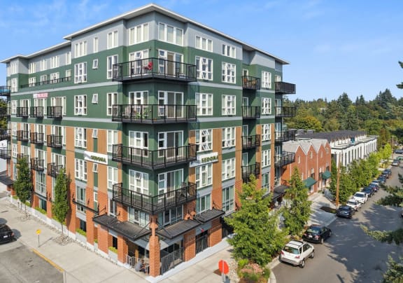 an aerial view of an apartment building on a city street