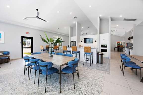 A room with a long table and chairs.