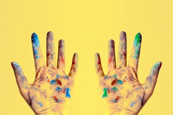 A pair of hands covered in paintat River Oak Apartments, Louisville, KY, 40206