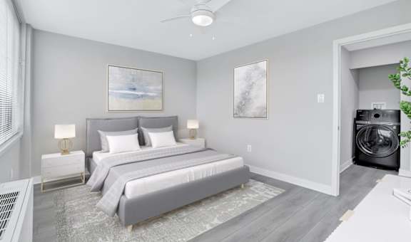 a bedroom with a bed and a ceiling fan