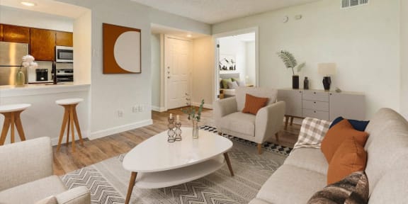 a living room with couches and a coffee table