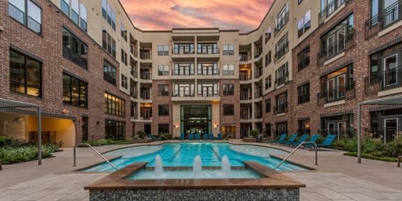 a swimming pool in the middle of an apartment building