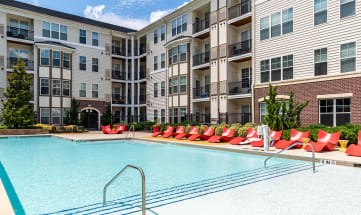 a swimming pool at the district flats apartments in lenexa, ks