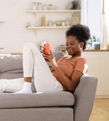 Lifestyle photo of woman at home on the couch