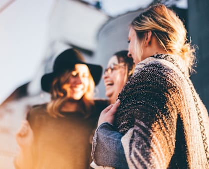 a group of women standing next to each other and laughing at River Oak Apartments, Louisville, KY, 40206