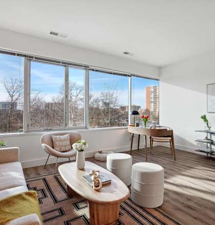 a living room with a large window and a couch at Sinclaire on Seminary, Alexandria, Virginia