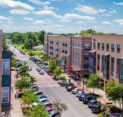 A street view of a town with cars parked on the side of the road.at The Foundry, South Bend Indiana