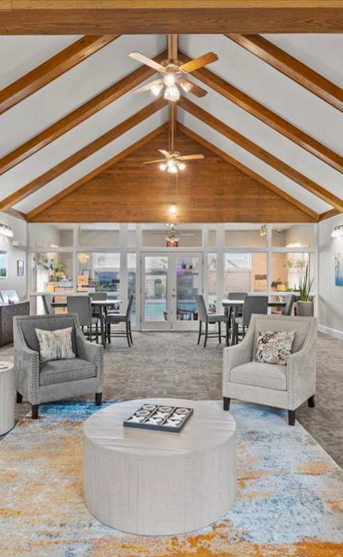 a living room with couches and chairs and a table