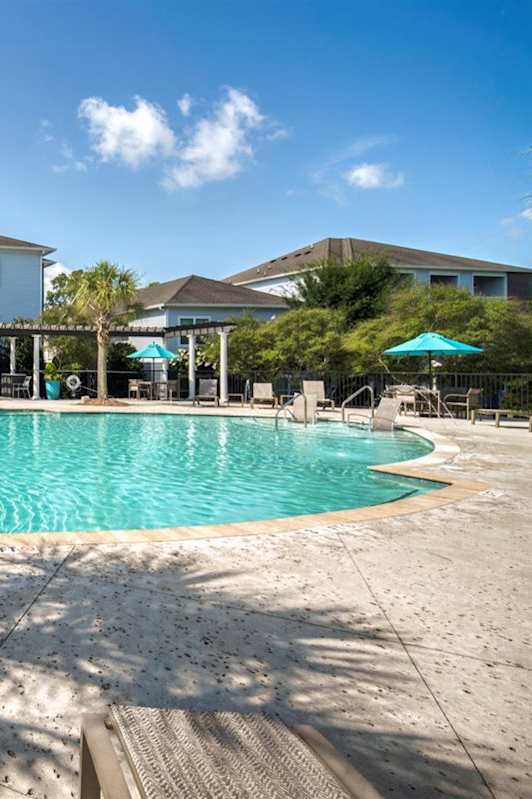 A large swimming pool in front of a building at Waterleaf at Neely Ferry Apartments, Simpsonville, SC 29680