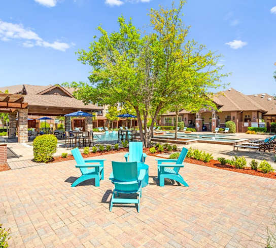 the preserve at ballantyne commons courtyard with blue chairs and trees