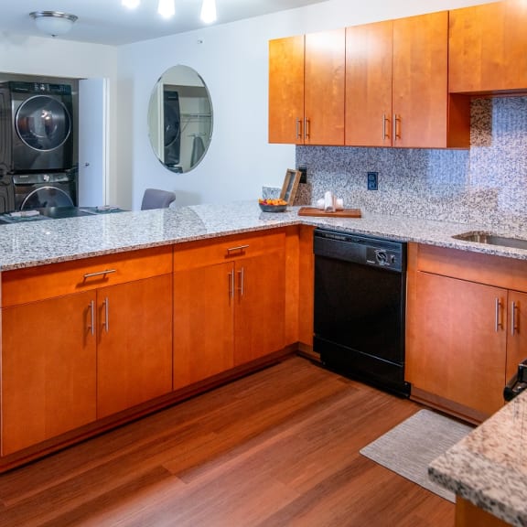 a kitchen with wooden cabinets and a counter top