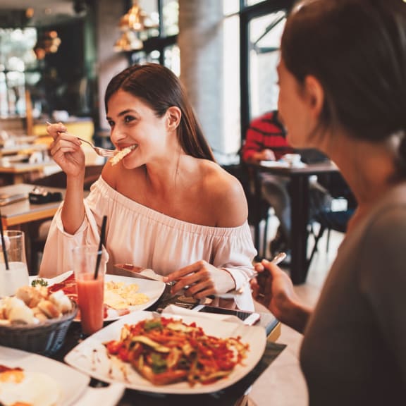 A group of people enjoying a meal together at a restaurant.