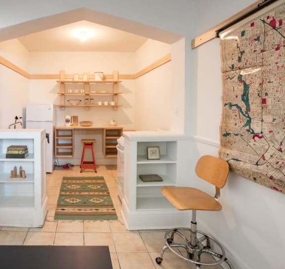 a bedroom with a bed and a door to a bathroom