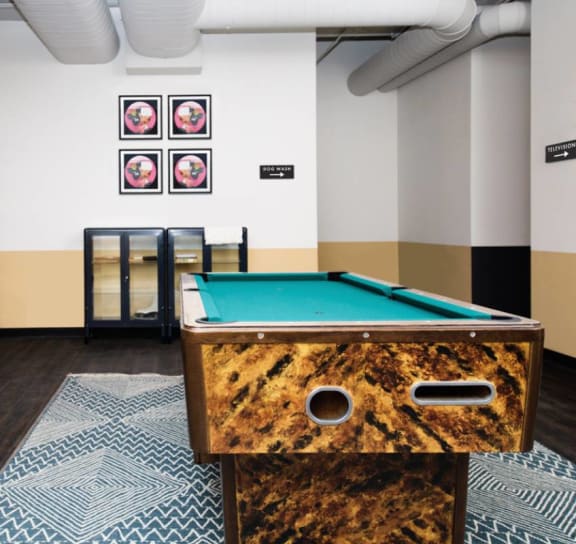 The Edison apartments game room with billiards