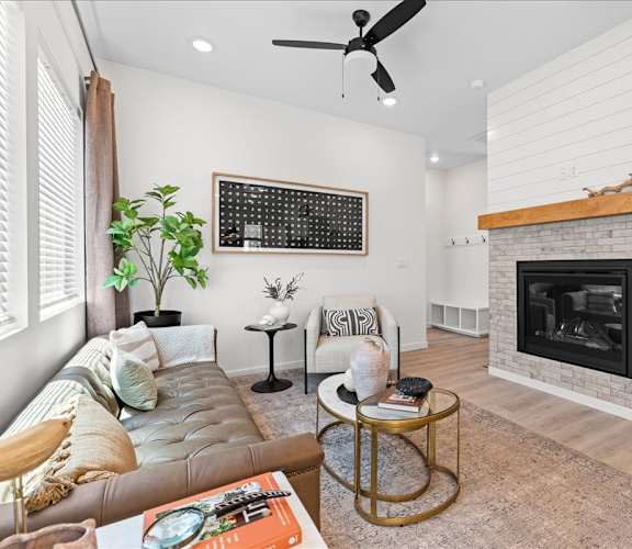 A living room with a fireplace and a couch.