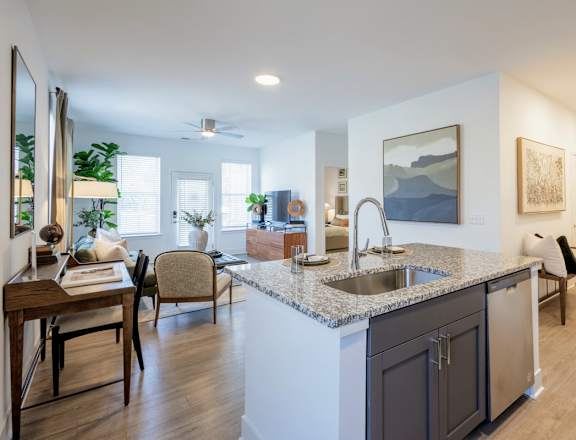 A modern kitchen with a dining table and chairs.