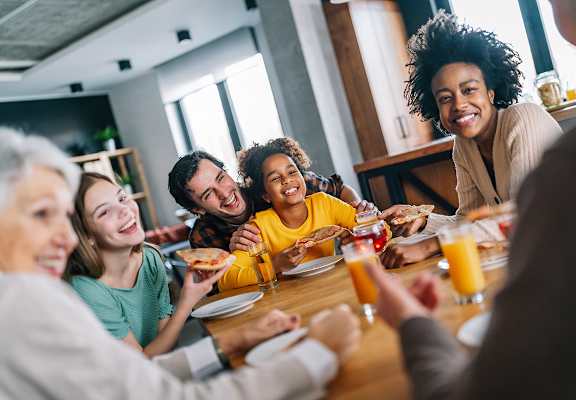 Lifestyle photo of family laughing at home at Oaks at Pompano, Pompano Beach, FL