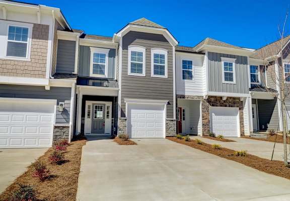 a house with a long driveway in front of it