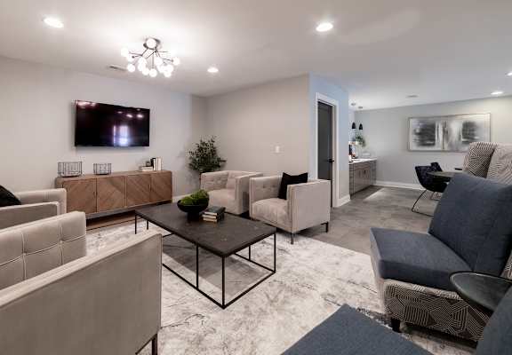 TV room with seating at Governor Square Apartments, Carmel, IN