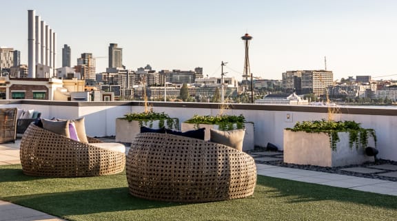a roof top patio with a view of the city