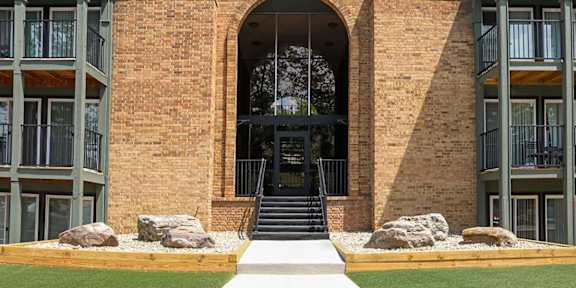 A brick building with the number 305 on it.