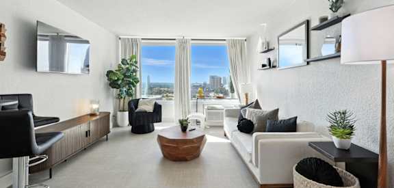 A modern living room with a view of the city.