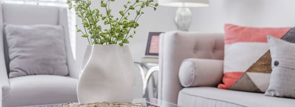 a dining room and living room with a table and chairs