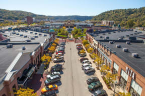 an aerial view of a parking lot with cars parked