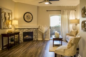 One Bedroom Apartments in Roseville CA - Vineyard Gate - Living Room with Wood-Style Flooring and an interior fireplace