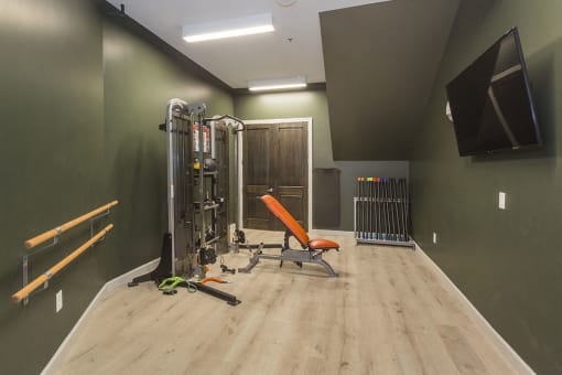 Gym with Free Weights at Luxury Apartments Near UCHealth Memorial Hospital