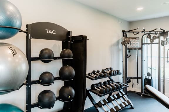 a home gym with weights and a punching bag