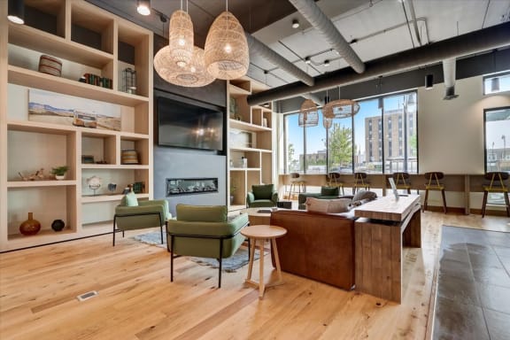 a living room with wood floors and a large window