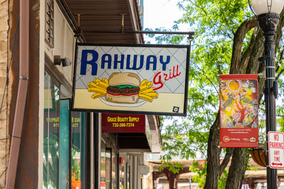 a sign for a restaurant on a city street