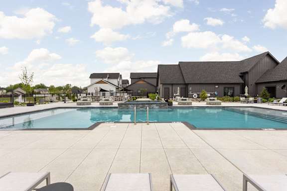 the swimming pool at the estates apartments
