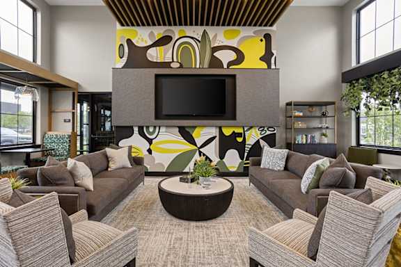 a large living room with couches and a television at Slate at Fishers District, Fishers, 46037