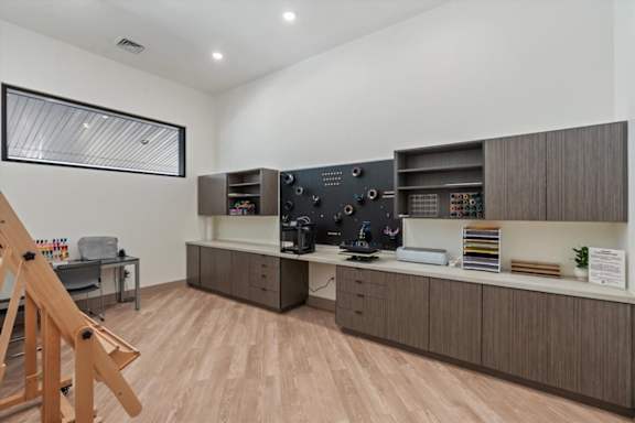 A room with a wooden floor and a television on a cabinet at Solhavn Apartments, American Fork, UT