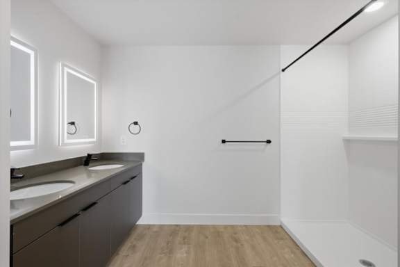 A bathroom with a white wall and a black line on it at Brickside Heights, Utah, 84106